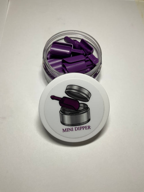 Jar of purple mini dippers with a white lid on a light gray background